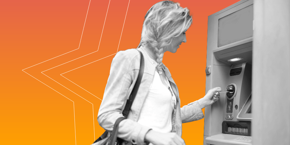 Woman inserting card into an ATM