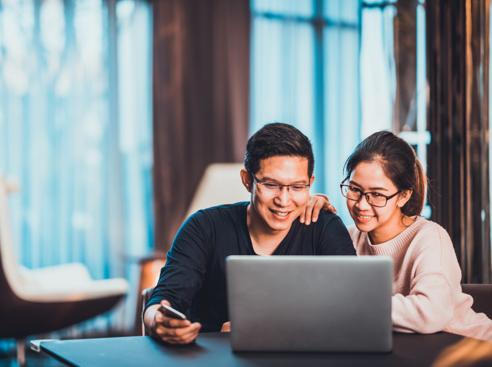 Young couple looking at a laptop