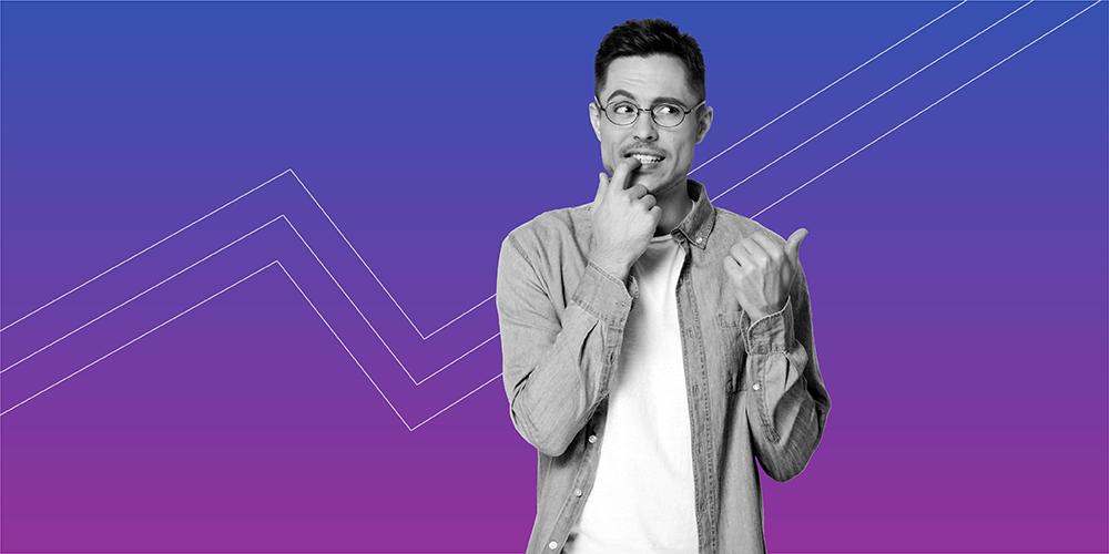 Man with glasses biting his fingernail