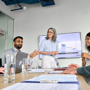Employees having a corporate meeting