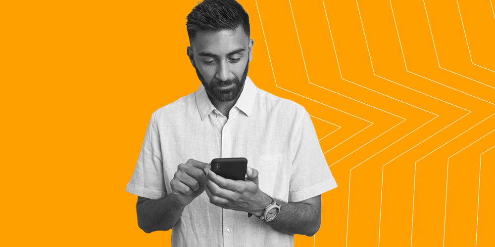 Man typing on his phone