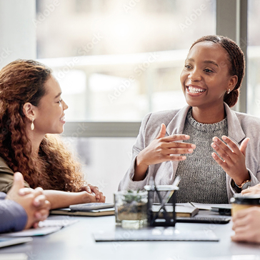 Woman presenting in a corporate meeting setting