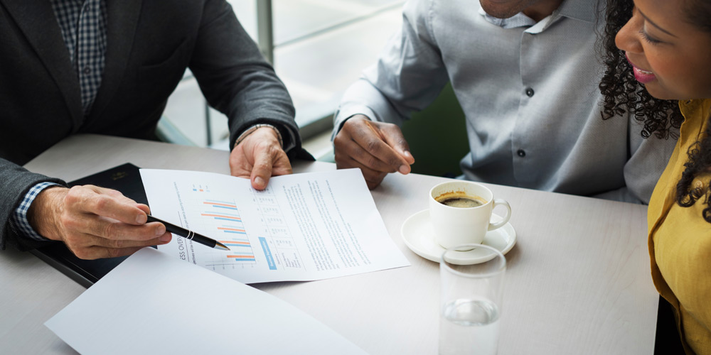 Man showing graphs to clients