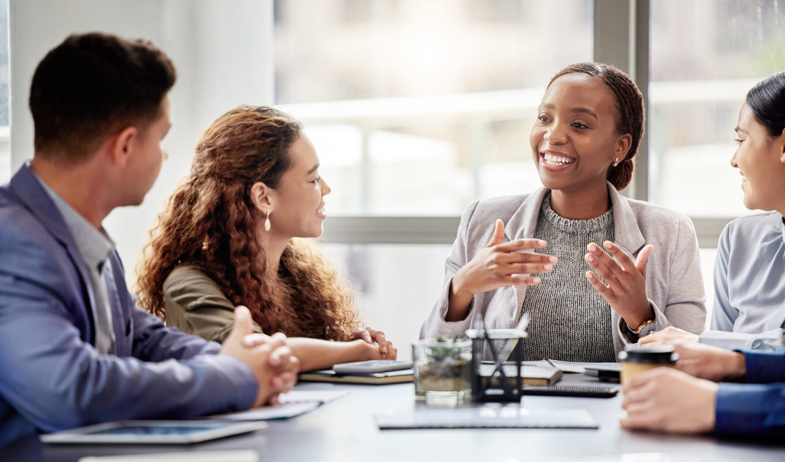 Woman presenting in a corporate meeting setting